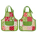 The two completed hot pads colored in bright green, red, and cream fabrics, from the Buon Natale collection, isolated on a clean white background.