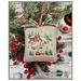 The completed project, a small snowy village, staged with coordinating winter and holiday decor.