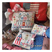 The completed project, three small pillows, staged with coordinating patriotic decor.