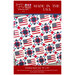 The front of the Made In The USA Quilt Pattern, showing the finished quilt held up in front of a brick wall.