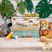 A stack of the fabrics included in the Safari Snuggles FQ Bundle, with jungle leaves and a Zebra plush and a Cheetah plush and wooden animals and blocks and a rattle.