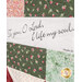 A super close up on the patchwork of the quilt, highlighting a panel piece that reads, 