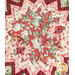 A top down view of the center of the topper, demonstrating details on the focus fabric, a red-pink fabric with sprawling roses and leaves.