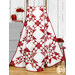 A shot of the quilt draped over a wooden ladder to show form and drape.