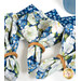 A closer look at three of the napkins, demonstrating details on the white floral fabric.