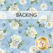 Light blue fabric swatch featuring tossed white flowers and blue small flowers. A transparent banner at the top reads 