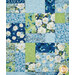 A close up on the patchwork of the quilt, demonstrating color and fabric details.