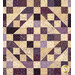 A super close up on one of the full patchwork blocks, a beautiful arrangements of cream and purple squares and triangles that form a diamond shape.