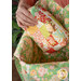 A model inserts the Mini Charm Bag into the Mondo bag, demonstrating the spaciousness of the bag.