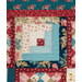 A super close up on one of the log cabin blocks, demonstrating fabric color and print details as well as top quilting effects.
