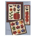 Scan of the back of the Autumn Breeze pattern book, showing the finished quilt and additional finished projects.