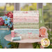A stack of the fabrics included in the Abide FQ collection, with a window and flowers and a jar and a vase and thread.