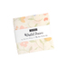 A tiny stack of white, pink, green, and purple floral prints labeled 