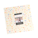 A stack of white, pink, green, and purple floral prints labeled 