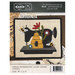 Front of the pattern showing the completed project, a sewing machine with beehive and bees.