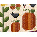 A shot of a pieced crow standing on top of a pumpkin, showcasing fabric and stitching details.