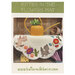 Front cover of pattern, showing the completed project on a rustic wood panel background.