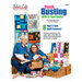 The front of the Stash Busting With 3-Yard Quilts book, featuring Donna Robertson and Fran Morgan sitting on the ground holding precuts next to boxes of their fabric stash. 