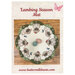 Front cover of pattern, showing the completed project on a rustic wood panel background.