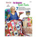 The front of the Fat Quarter Quilt Treats book, featuring Donna Robertson sitting on a chair with a quilt draped over her lap.