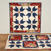 A shot of the completed Countryside design in a wall hanging and bed scarf.