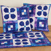 A shot of the completed Forget-Me-Not design in a pillowcase and bed scarf.