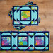 A shot of the completed Mayfair design in placemats and table runner.