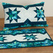 A shot of the completed Promenade design in a pillowcase and table runner.