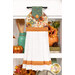 The completed Hanging Towel colored in cream, orange, and teal fabrics from The Awe of Autumn collection, staged on a kitchen drawer with coordinating decor.