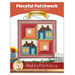 Front cover showing the completed project's vibrantly colored log cabin and schoolhouse blocks.