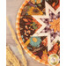 A super close up shot of a round hot pad, showcasing the star center, piecing, and binding.
