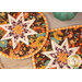 A close up top-down shot of the two overlapping hot pads, showcasing the beautiful autumn fabrics.