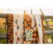 A shot of the quilt artfully draped over a fence, demonstrating fabric drape and form.
