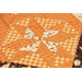 A close up on one of the quilting blocks on the autumn leaf.