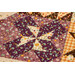 A close up on one of the quilting blocks on the autumn leaf.