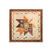 The completed Pressed Leaves quilt colored in autumn fabrics from the The Awe of Autumn collection, isolated on a white background.