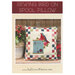 The front cover showing an showing the completed wall hanging pattern of a ball jar filled with sewing tools with a border of thread spools.