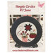 The front of the pattern showing the finished project displayed on a plate for decor.