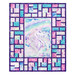 The completed Stained Glass Panel Quilt, colored in blue, pink, and white fabrics from the Sparkle Magic collection by Northcott Fabrics, isolated on a white background.