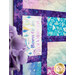 A stylized close up on the Stained Glass patchwork of the quilt, showing details on the color, print, and top quilting.