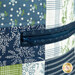 A super close up shot of the zippered pocket on the side of the tote bag.