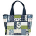 The completed Charming 8 Pocket Tote, colored in navy, blue, white, and green fabrics from the Nantucket Summer collection, isolated on a white background.