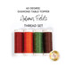 Four spools of thread in autumn colors, isolated on a white background below a text graphic.