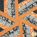 A top down shot of the center patchwork of the topper, demonstrating fabric color and details.