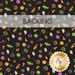 A swatch of black fabric with scattered Halloween candy motifs like ghost popsicles, candy corn, and lollipops. A transparent banner at the top read 