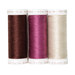 The thread set for the Point of View Folded Star Table Topper - Rustle, three spools of red, magenta, and cream thread, isolated on a white background.
