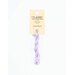 A skein of light purple embroidery floss, twisted and bundled, with a cream and black label featuring the brand name and color information.