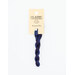 A skein of variegated dark blue and dark purple embroidery floss, twisted and bundled, with a cream and black label featuring the brand name and color information.