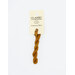 A skein of burnt orange embroidery floss, twisted and bundled, with a cream and black label featuring the brand name and color information.