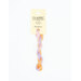 A skein of variegated peach, light purple, and hot pink embroidery floss, twisted and bundled, with a cream and black label featuring the brand name and color information.